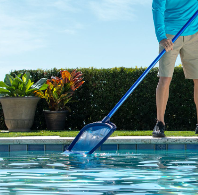 Man cleaning pool